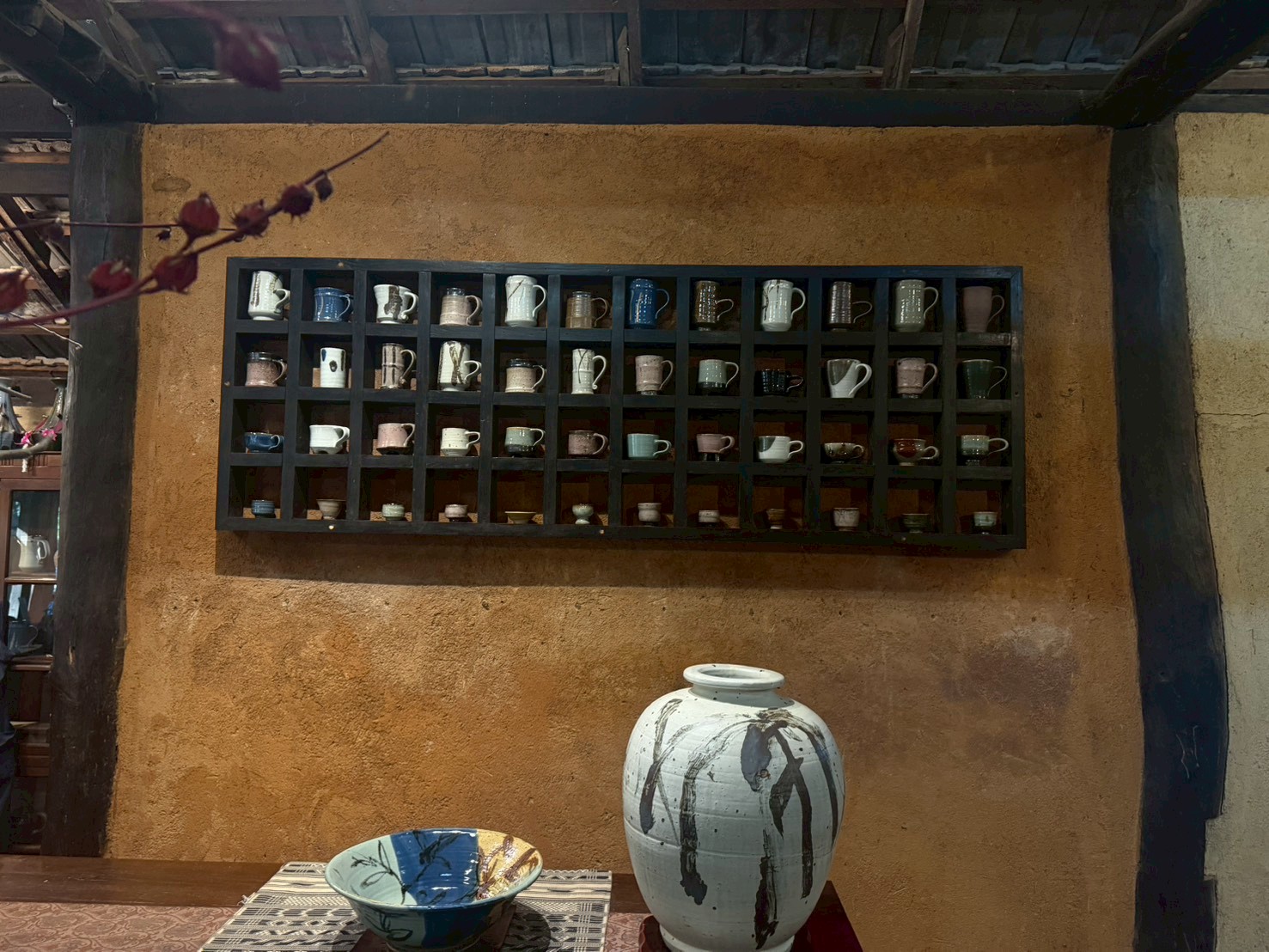 The mug wall with over 40 one-of-a-kind pieces
