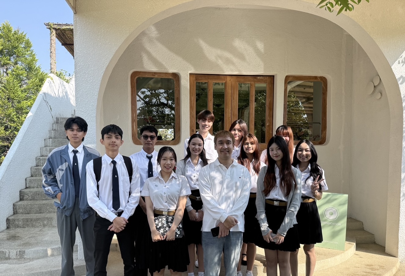 Our team seated with the founder of Friendcation Café