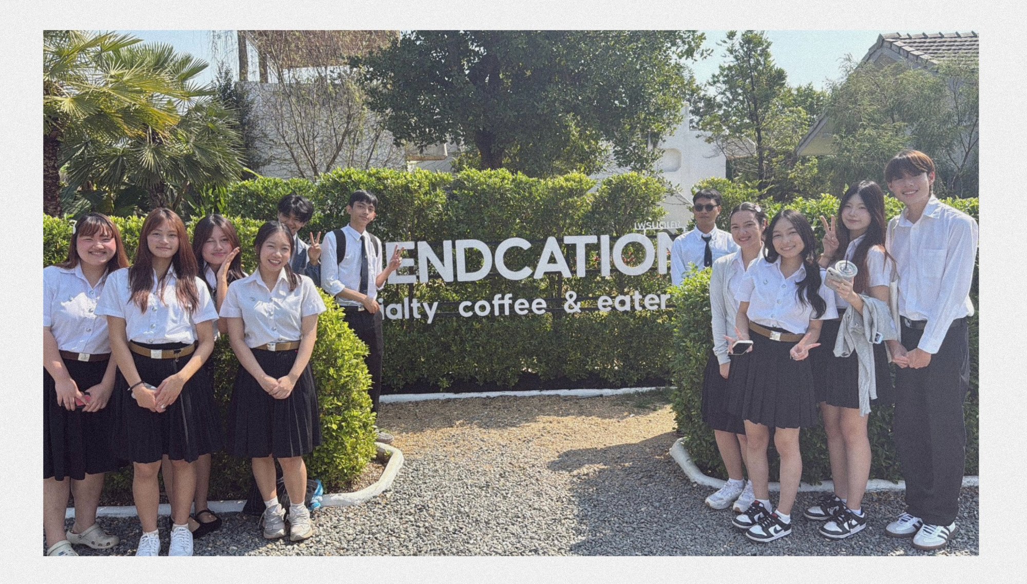 Group 9 gathered at Friendcation café, smiling together